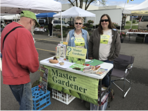 master gardeners at farmers' market table